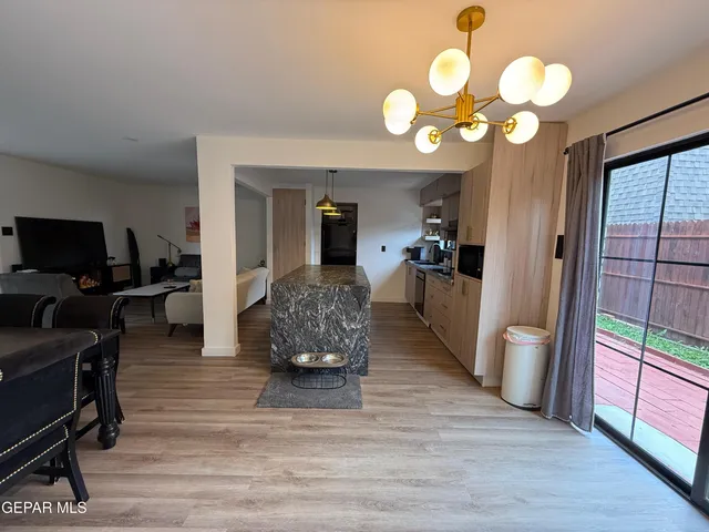 a living room with furniture and a large mirror