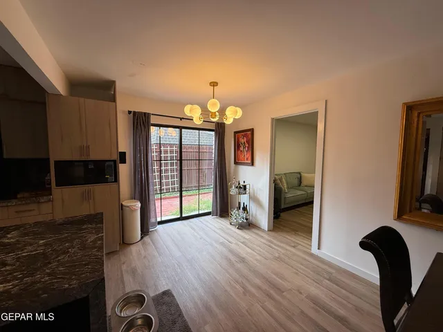 a view of a livingroom with furniture and front door