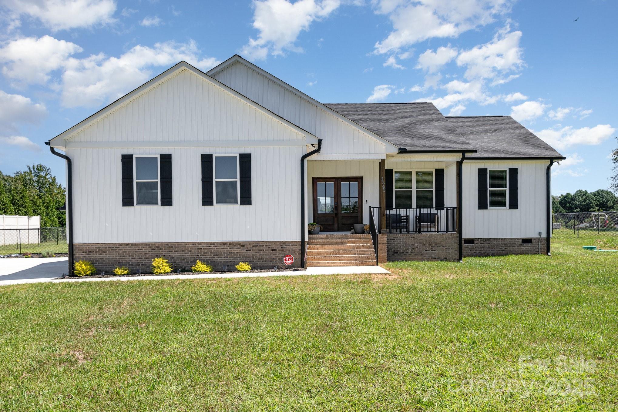125 St Peters Church Road Gold Hill, NC 28071 - Photo 1 of 33 a front view of a house with a yard