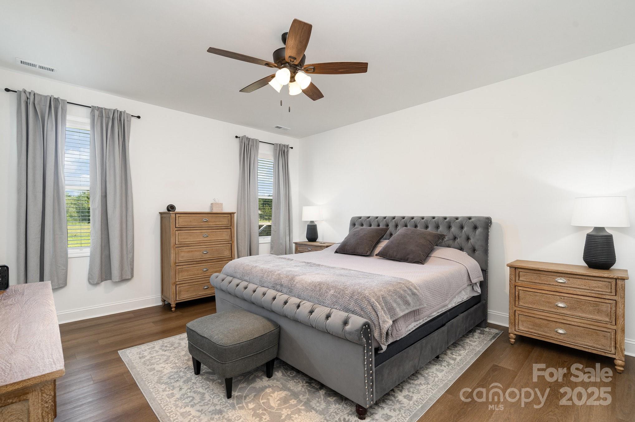 125 St Peters Church Road Gold Hill, NC 28071 - Photo 15 of 33 a bedroom with a bed and ceiling fan