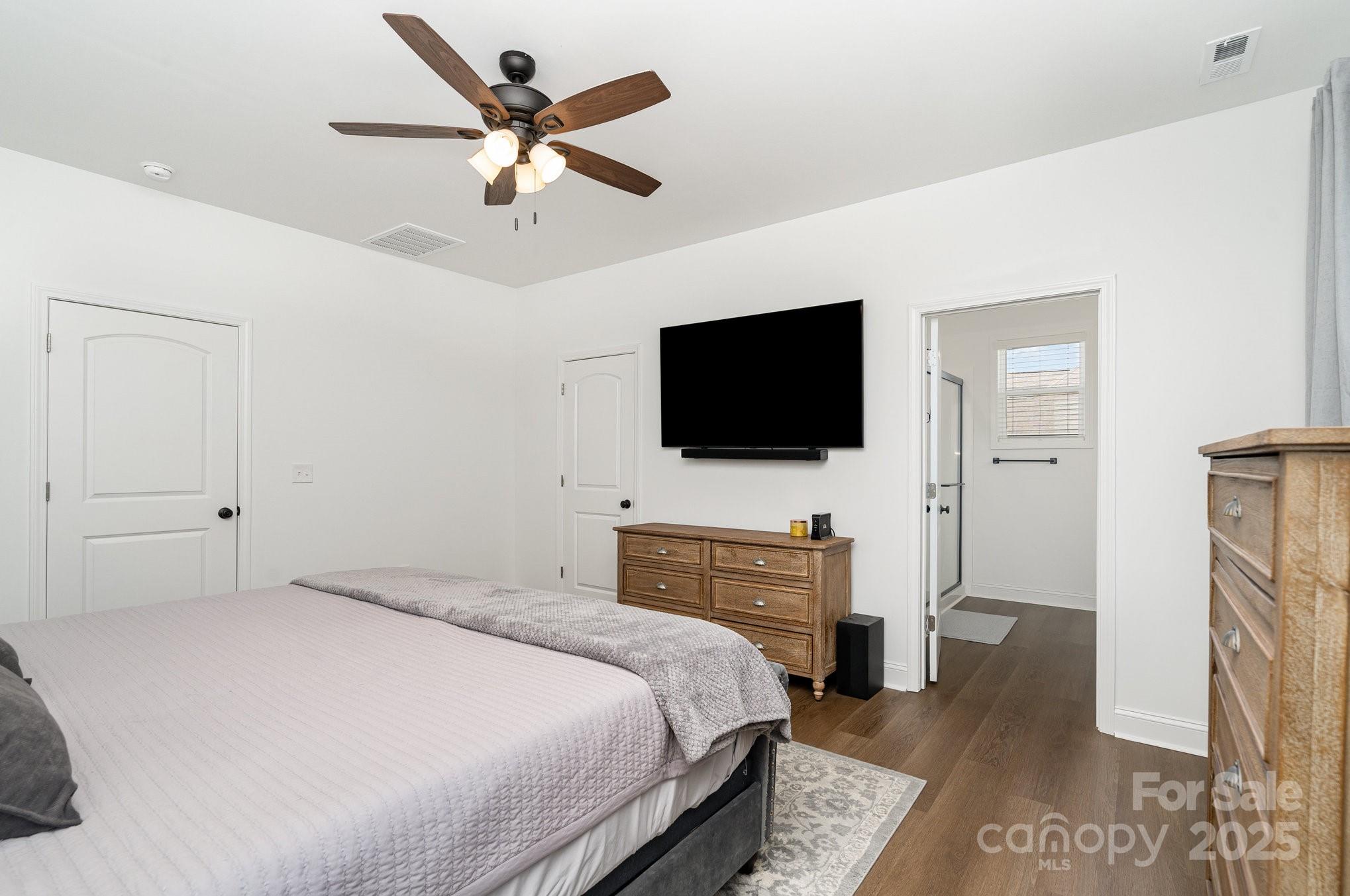 125 St Peters Church Road Gold Hill, NC 28071 - Photo 17 of 33 a bedroom with a bed and a flat screen tv