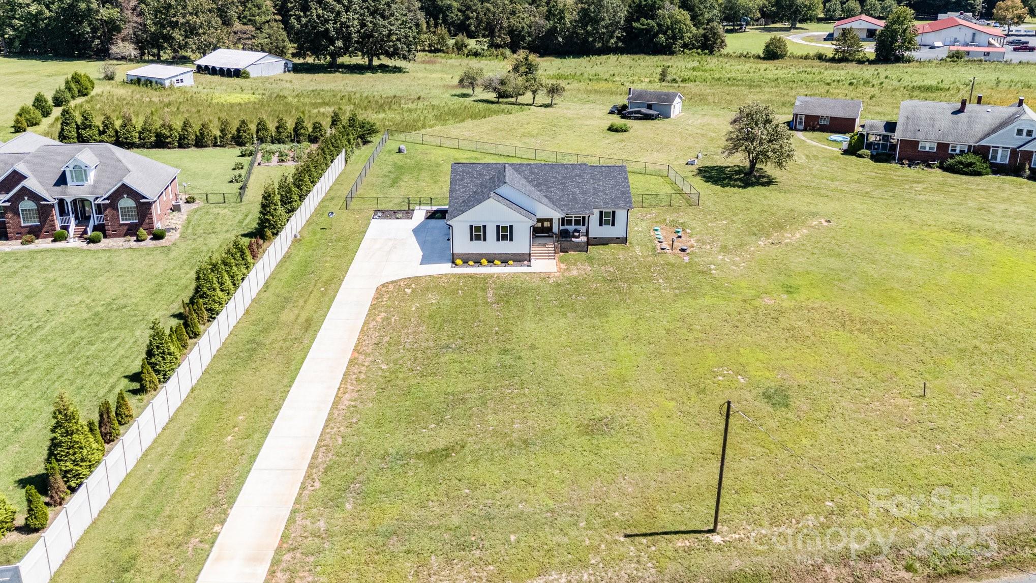 125 St Peters Church Road Gold Hill, NC 28071 - Photo 2 of 33 a view of a swimming pool and a yard