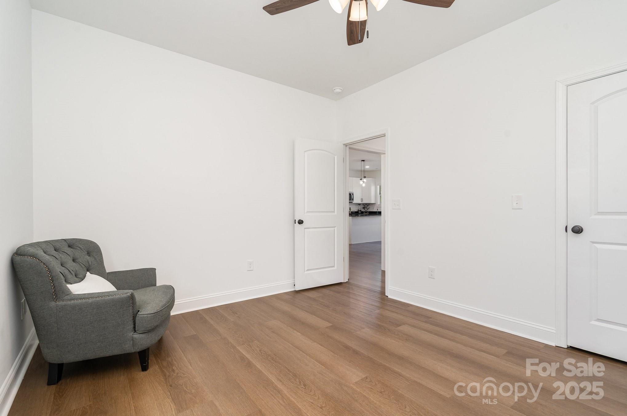 125 St Peters Church Road Gold Hill, NC 28071 - Photo 23 of 33 a living room with furniture and a ceiling fan
