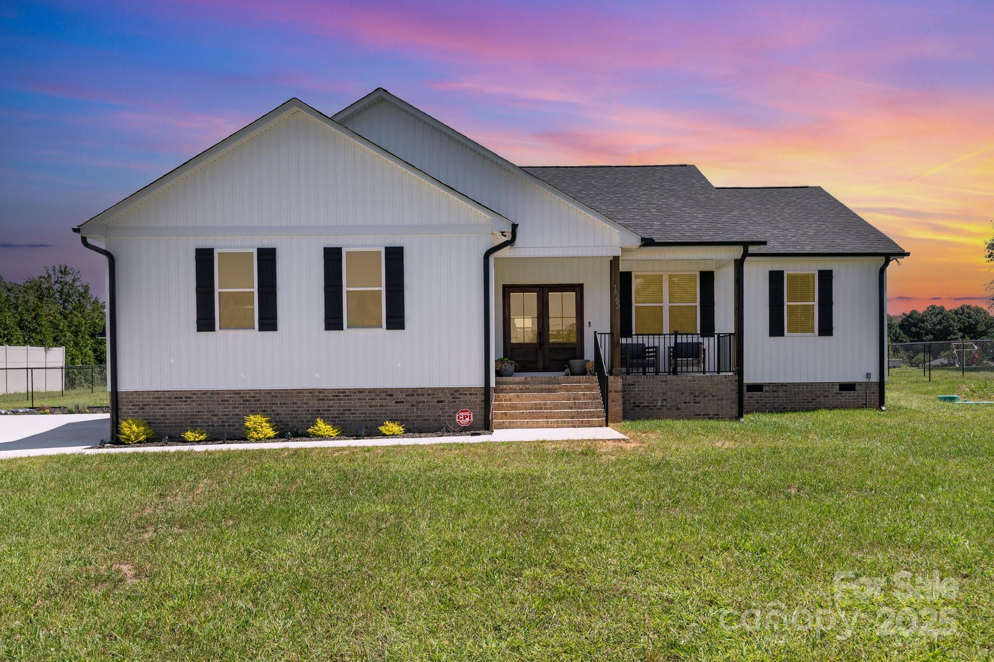 125 St Peters Church Road Gold Hill, NC 28071 - Photo 4 of 33 a front view of a house with a yard