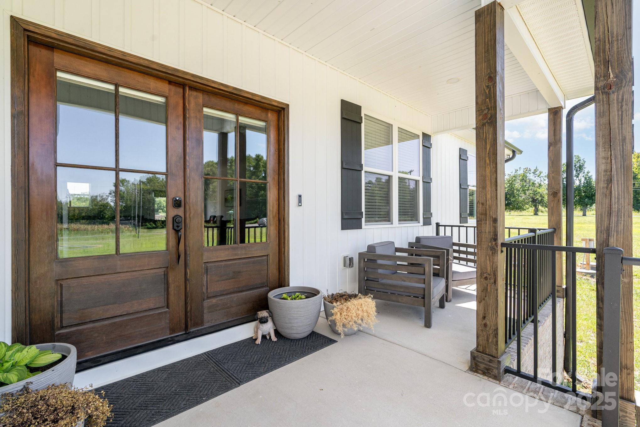 125 St Peters Church Road Gold Hill, NC 28071 - Photo 5 of 33 a bedroom with furniture and large windows