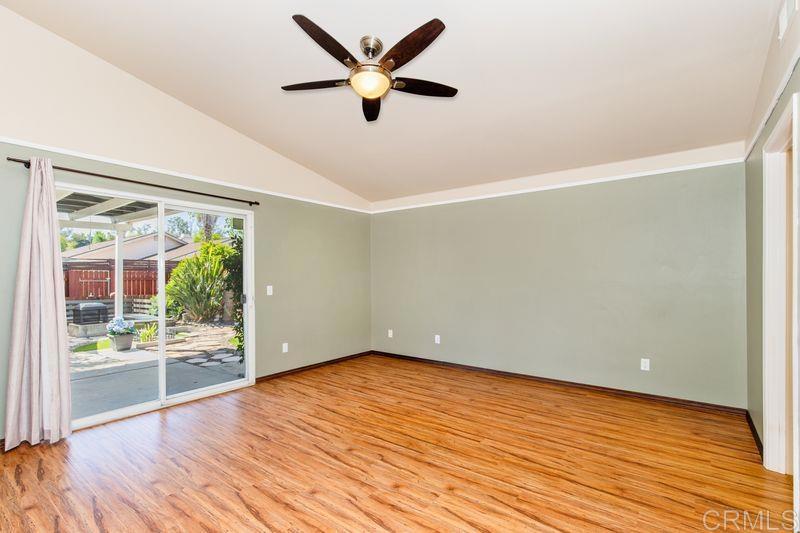 322 G Street Ramona, CA 92065 - Photo 14 of 61 an empty room with wooden floor and windows