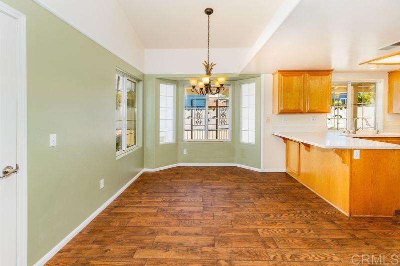 322 G Street Ramona, CA 92065 - Photo 15 of 61 a view of a kitchen with granite countertop cabinets and a chandelier
