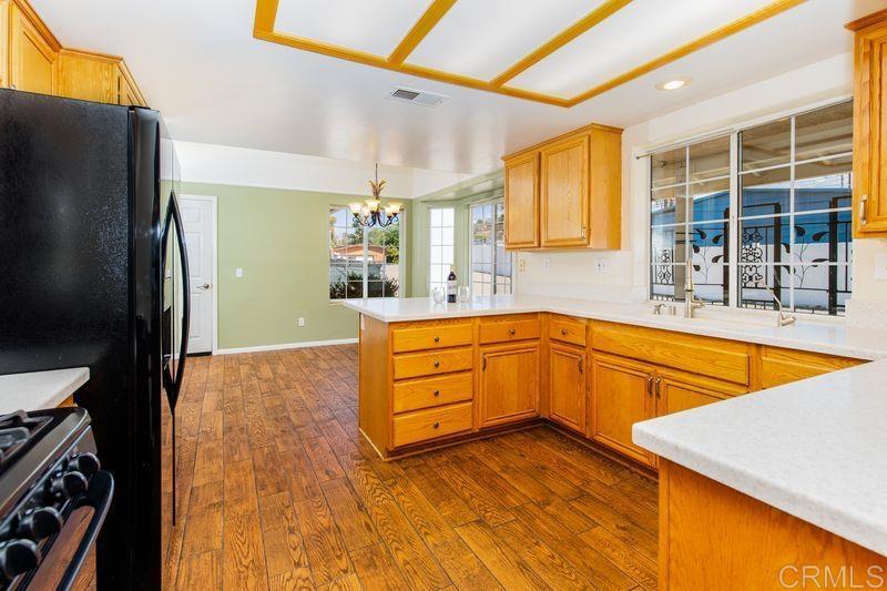 322 G Street Ramona, CA 92065 - Photo 21 of 61 a spacious bathroom with a granite countertop sink and a large mirror