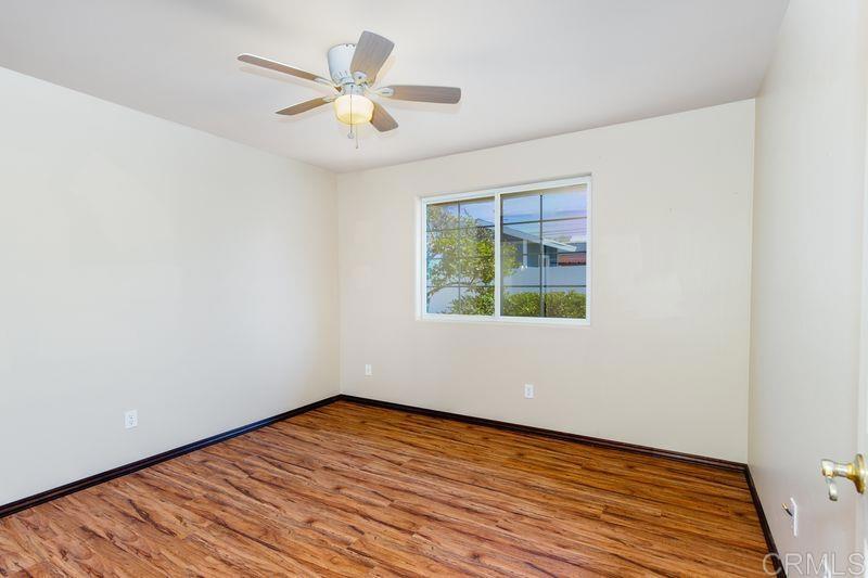 322 G Street Ramona, CA 92065 - Photo 24 of 61 an empty room with wooden floor and windows