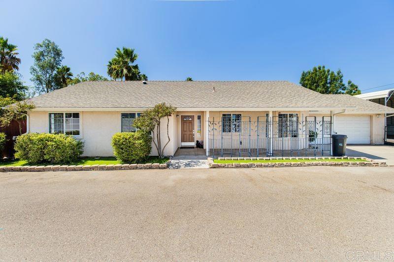 322 G Street Ramona, CA 92065 - Photo 3 of 61 a front view of a house with a yard and a garage