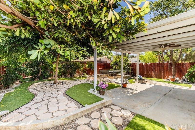 322 G Street Ramona, CA 92065 - Photo 32 of 61 a view of a backyard with table and chairs potted plants