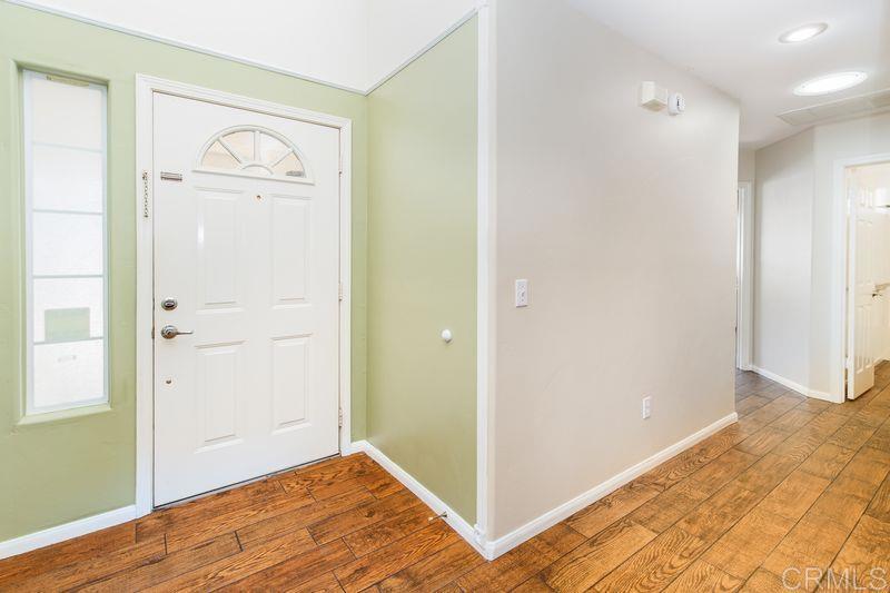 322 G Street Ramona, CA 92065 - Photo 5 of 61 a view of a hallway with wooden floor