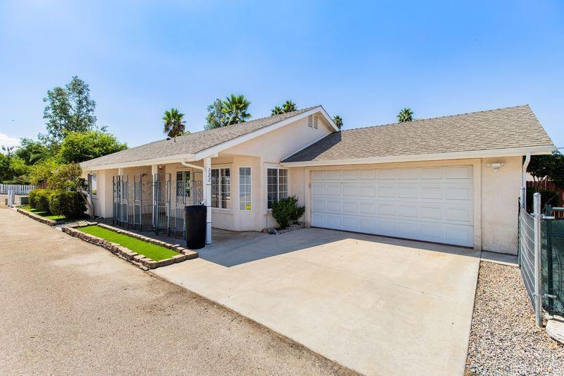 322 G Street Ramona, CA 92065 - Photo 54 of 61 a view of house with backyard and trees in the background