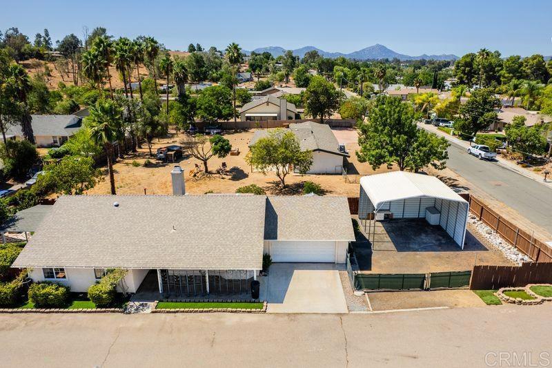 322 G Street Ramona, CA 92065 - Photo 60 of 61 an aerial view of a house with a yard and parking spaces
