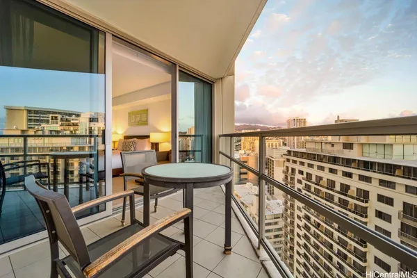 a view of a balcony with chairs
