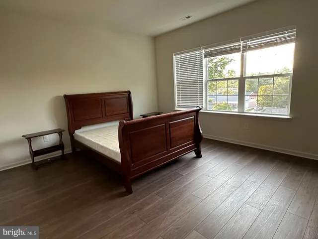a room with a bed and a chair