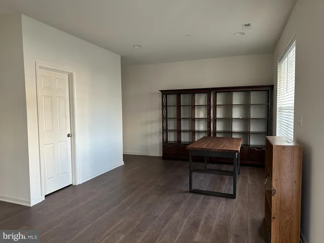 a living room with a furniture and a window