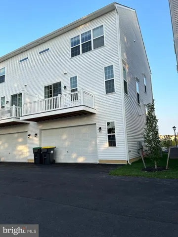 a front view of a house with many windows
