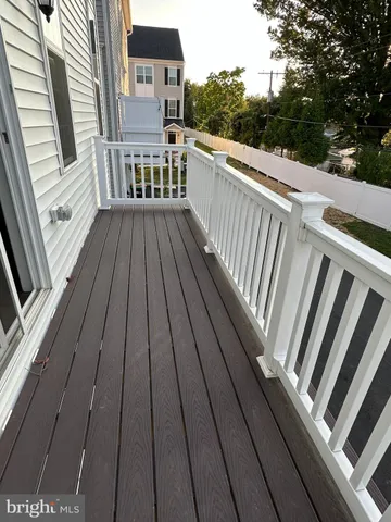 a view of a balcony with wooden floor