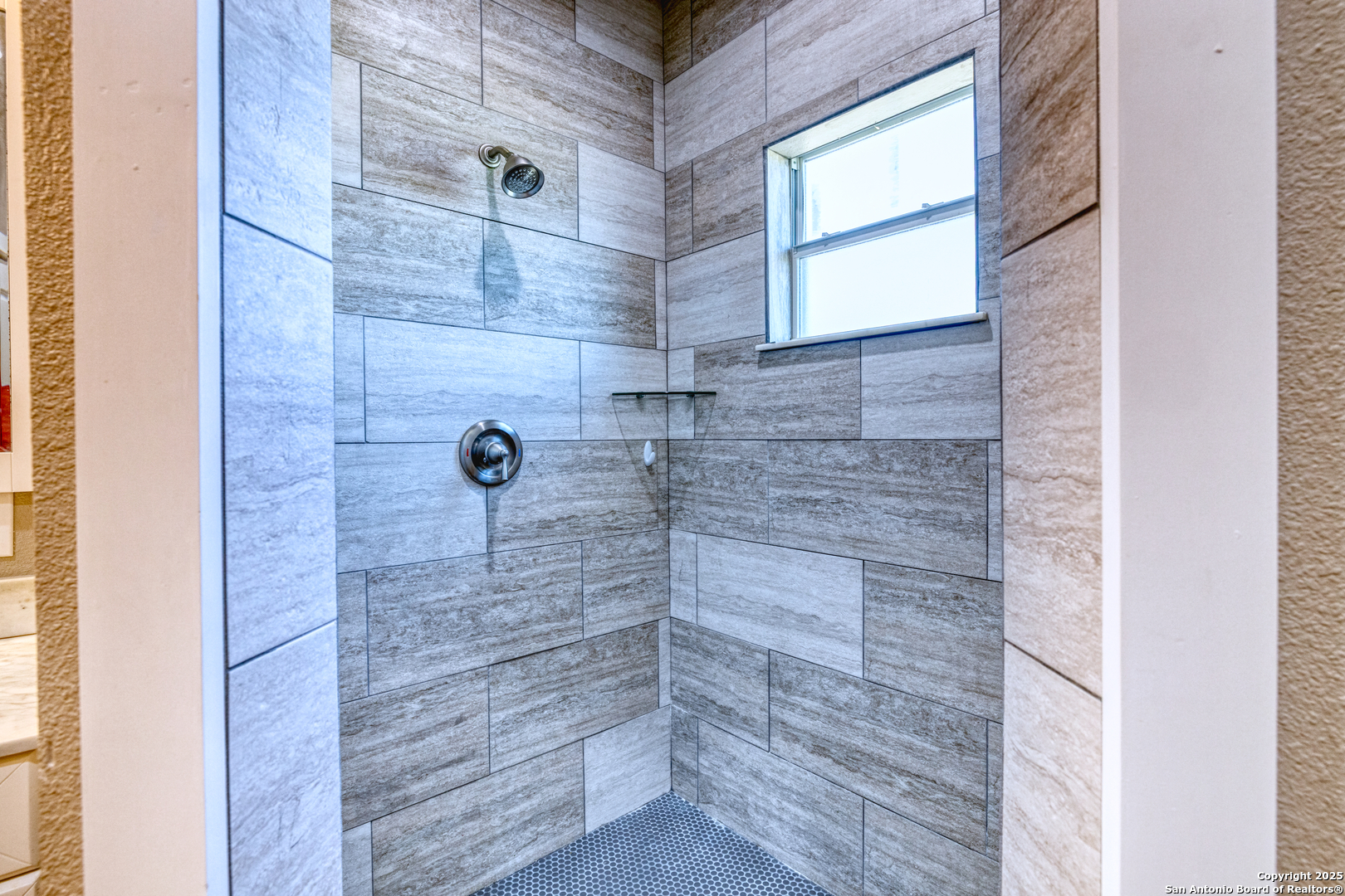 413 Guajillo Uvalde, TX 78801 - Photo 13 of 23 a bathroom with a shower