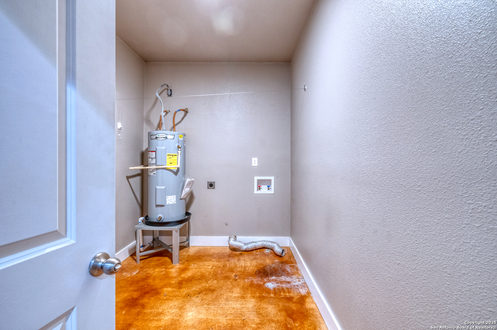 413 Guajillo Uvalde, TX 78801 - Photo 18 of 23 a room with chair and wooden floor