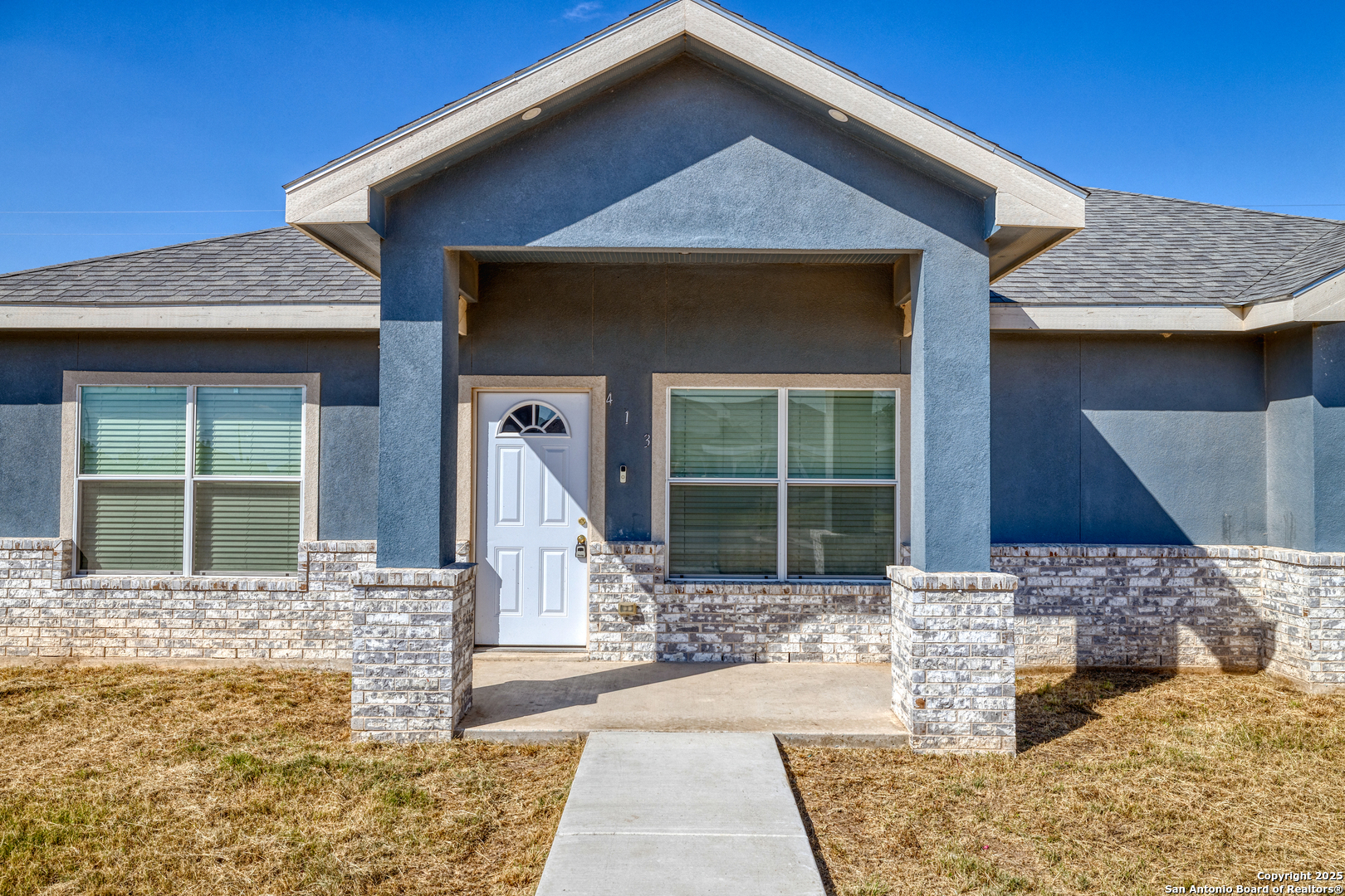 413 Guajillo Uvalde, TX 78801 - Photo 3 of 23 a front view of a house with garden