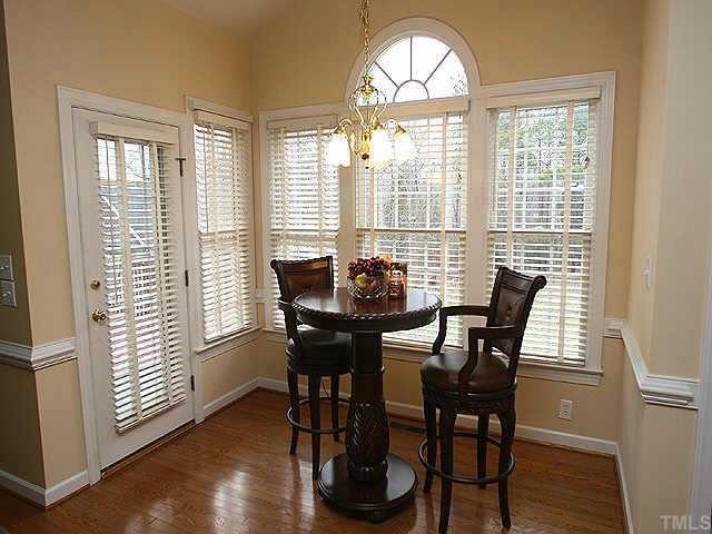 2624 Lizei Street Raleigh, NC 27616 - Photo 4 of 10 a view of a dining room with furniture window and wooden floor