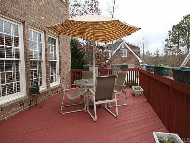 2624 Lizei Street Raleigh, NC 27616 - Photo 7 of 10 a patio with glass top table and chairs