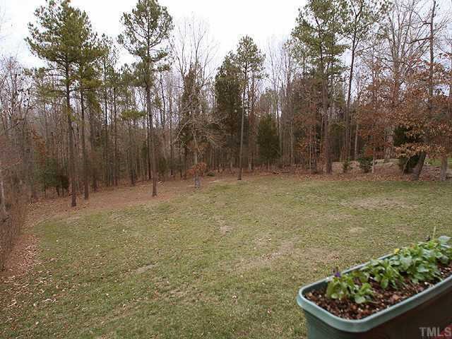 2624 Lizei Street Raleigh, NC 27616 - Photo 8 of 10 a backyard of a house with lots of green space