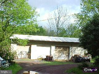 304 Upper Stump Road Chalfont, PA 18914 - Photo 2 of 6 a view of a yard with an outdoor space and a tree