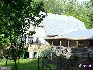 304 Upper Stump Road Chalfont, PA 18914 - Photo 6 of 6 a front view of a house with a garden