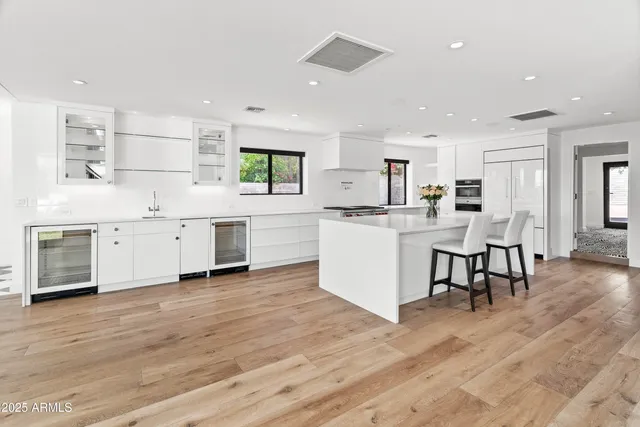 a kitchen with a table and chairs