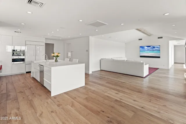 a view of kitchen with cabinets and wooden floor