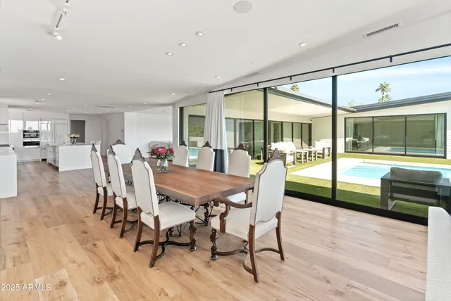 a view of a dining room with furniture window and wooden floor
