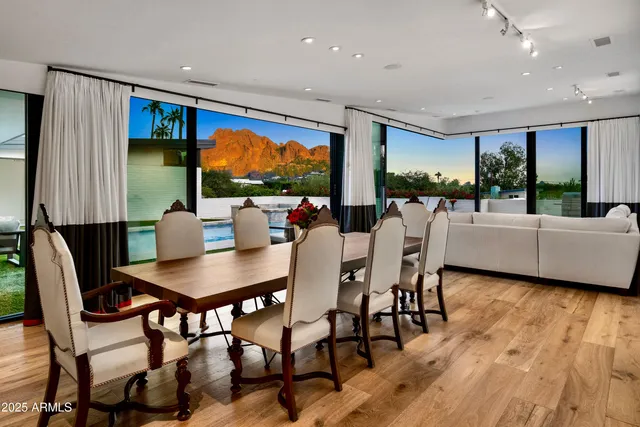 a view of a dining room with furniture window and wooden floor