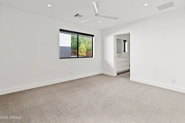 a bathroom with a sink toilet a mirror and vanity