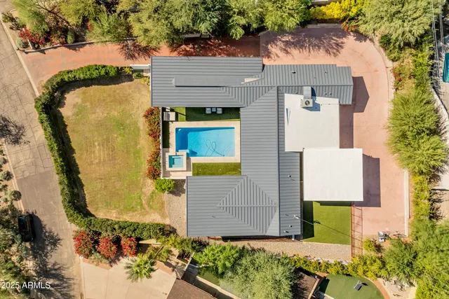 a view of a balcony with an outdoor space and seating area