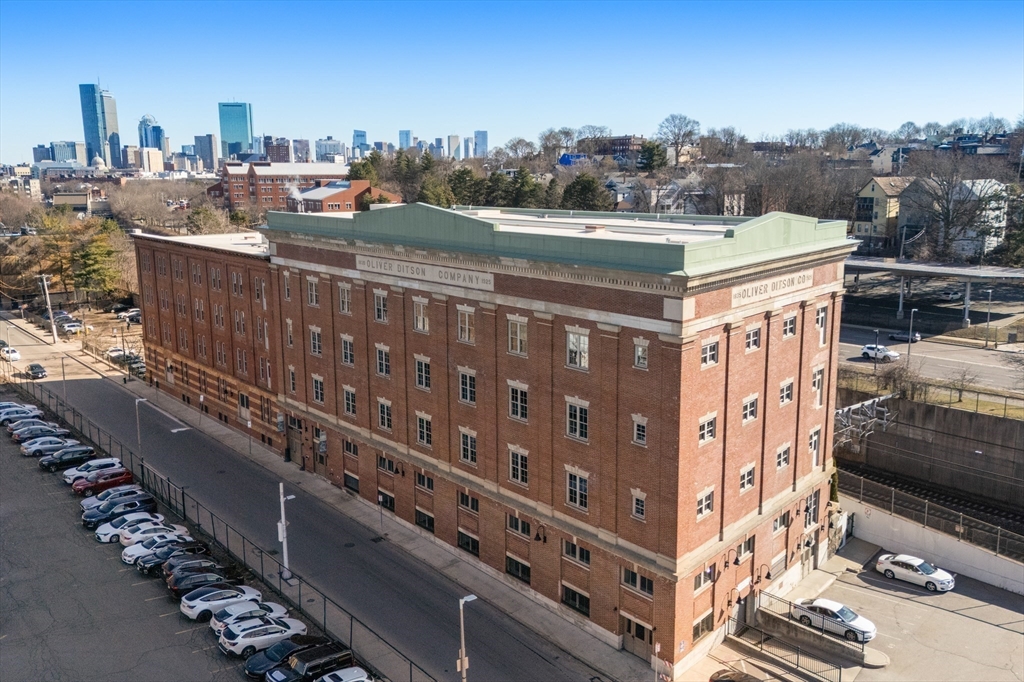 156-168 Terrace Street, Unit 402 Boston, MA 02120 - Photo 1 of 31 a view of a city with tall buildings