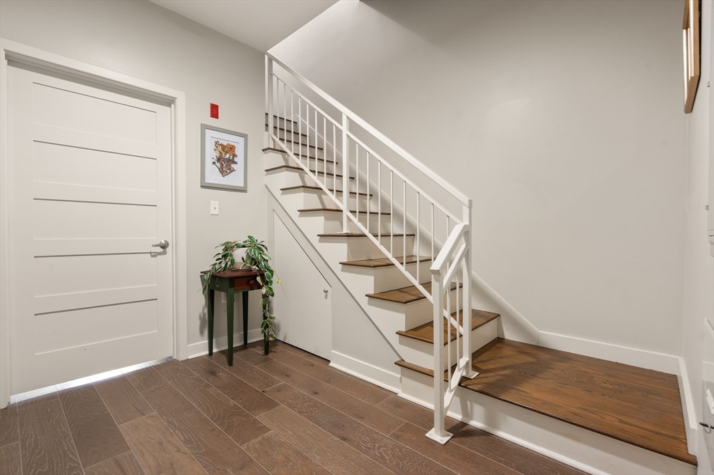 156-168 Terrace Street, Unit 402 Boston, MA 02120 - Photo 14 of 31 a view of entryway with wooden floor