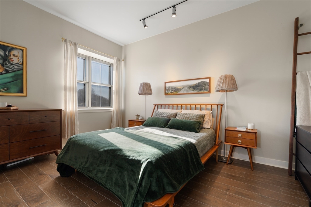 156-168 Terrace Street, Unit 402 Boston, MA 02120 - Photo 17 of 31 a bedroom with a bed and a window