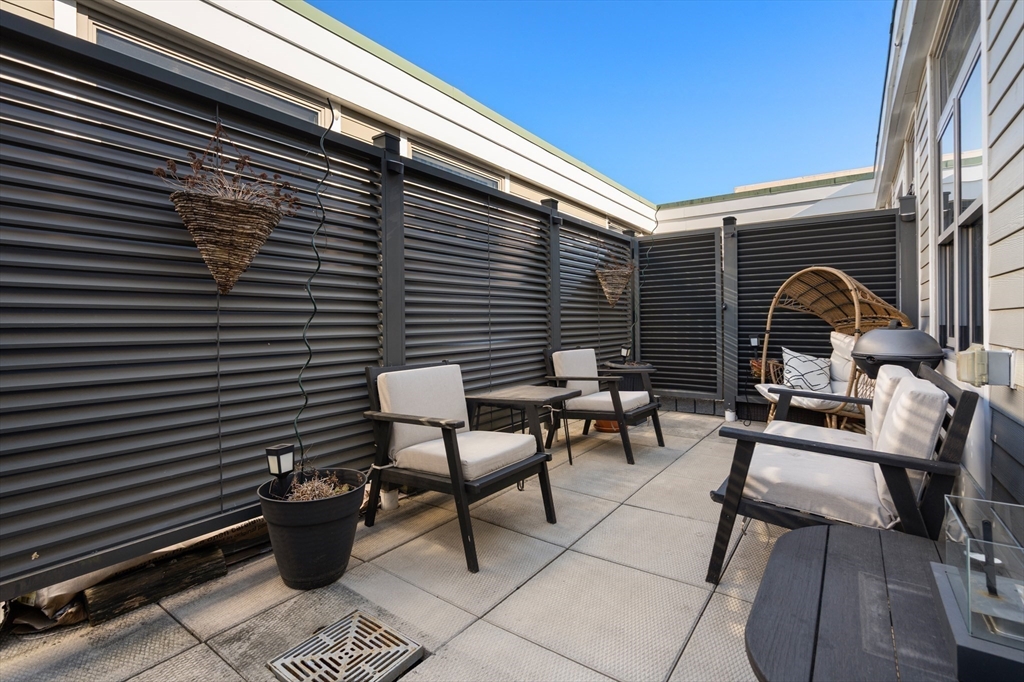 156-168 Terrace Street, Unit 402 Boston, MA 02120 - Photo 22 of 31 a view of backyard with sitting area