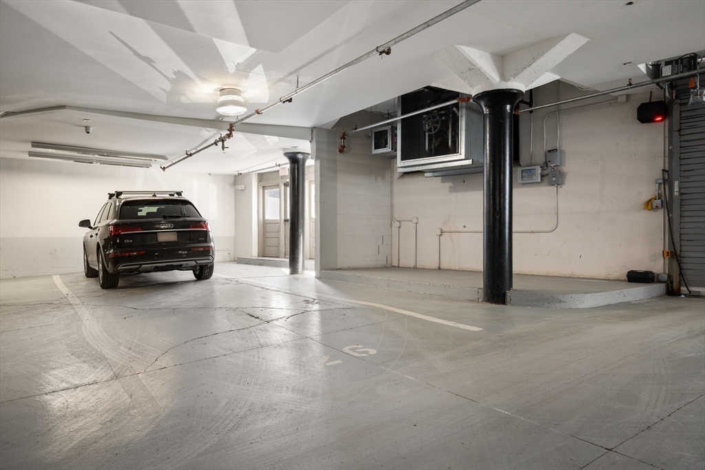 156-168 Terrace Street, Unit 402 Boston, MA 02120 - Photo 26 of 31 a car parked in garage