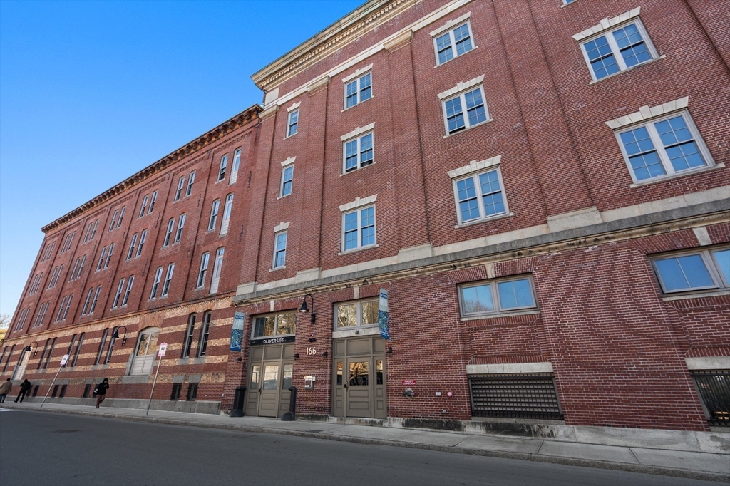 156-168 Terrace Street, Unit 402 Boston, MA 02120 - Photo 29 of 31 a tall building sitting on the side of a street