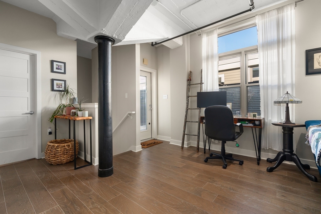 156-168 Terrace Street, Unit 402 Boston, MA 02120 - Photo 6 of 31 a view of a workspace with furniture and a window