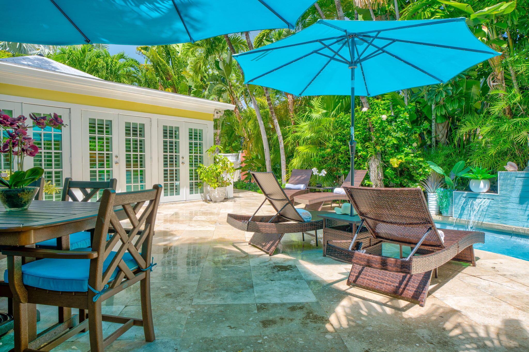 1501 White Street Key West, FL 33040 - Photo 3 of 49 a view of a patio with a table and chairs under an umbrella