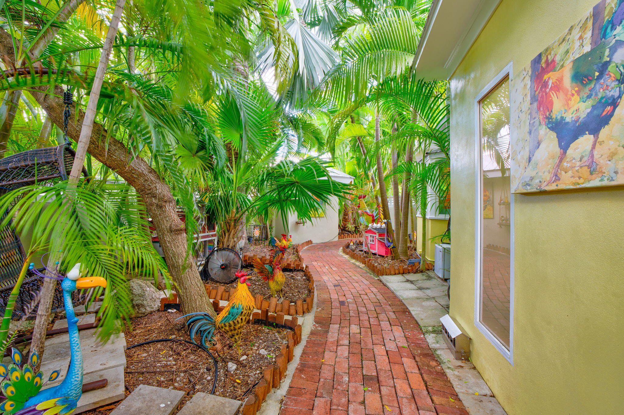 1501 White Street Key West, FL 33040 - Photo 37 of 49 a view of swimming pool with lounge chair and dinning table under an umbrella