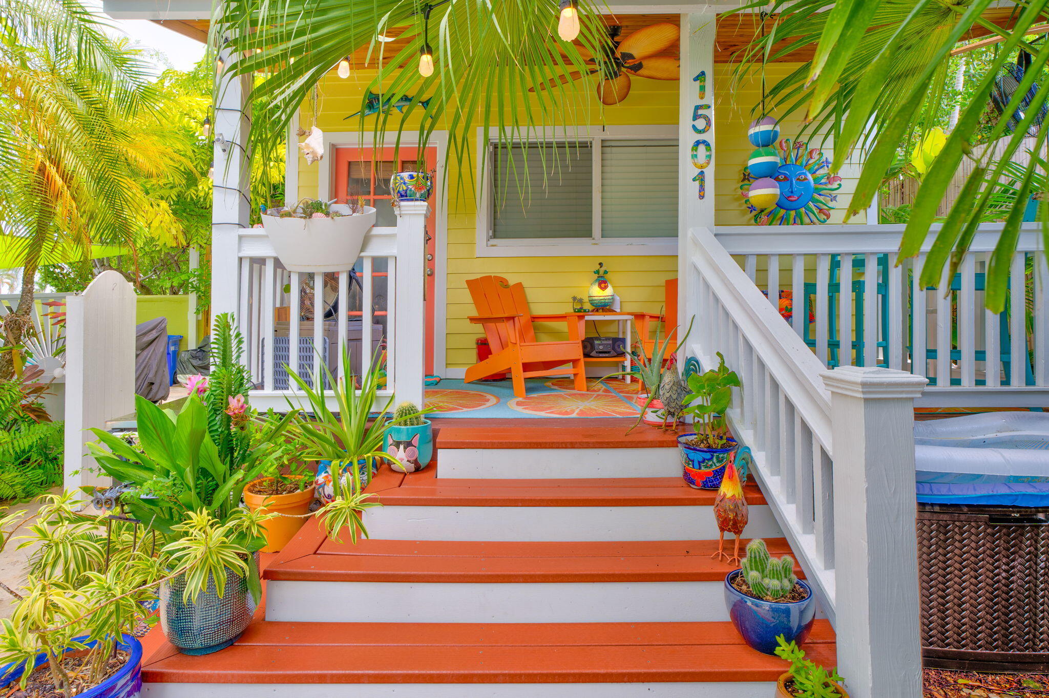 1501 White Street Key West, FL 33040 - Photo 39 of 49 a balcony with beautiful flowers and wooden floor