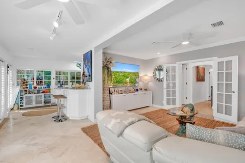 a bedroom with furniture and a flat screen tv