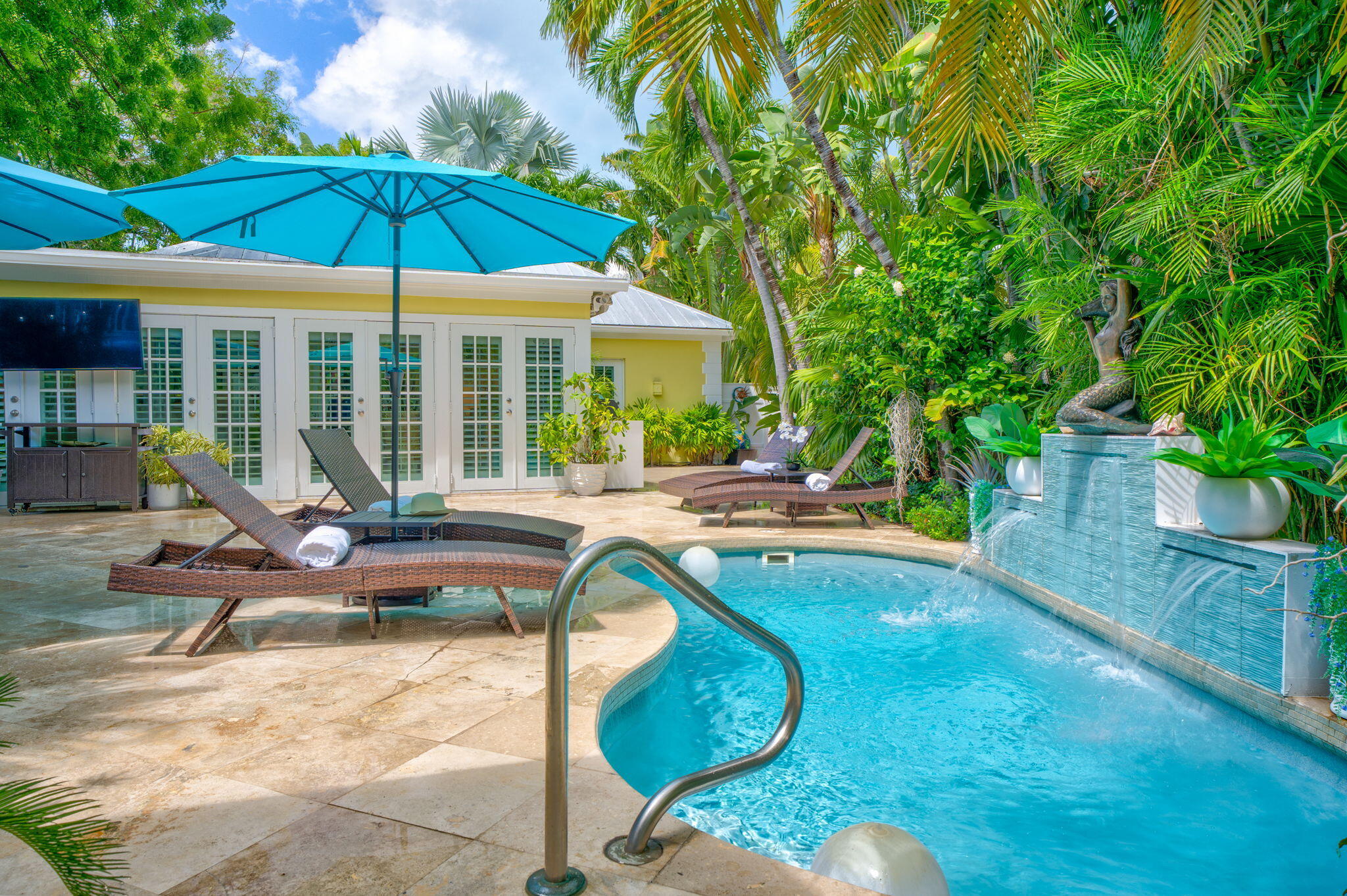 1501 White Street Key West, FL 33040 - Photo 48 of 49 a view of a swimming pool with lounge chairs in patio