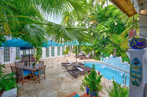 a view of a backyard with a sitting area and furniture